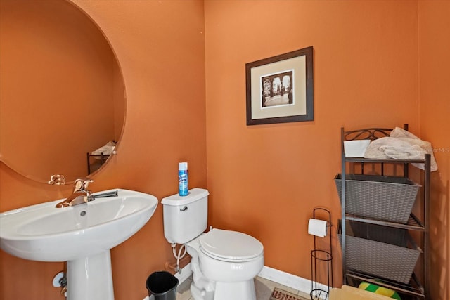 6907 47th Ct E, Ellenton, FL 34222 - bathroom with toilet, a sink, baseboards, and tile patterned floors