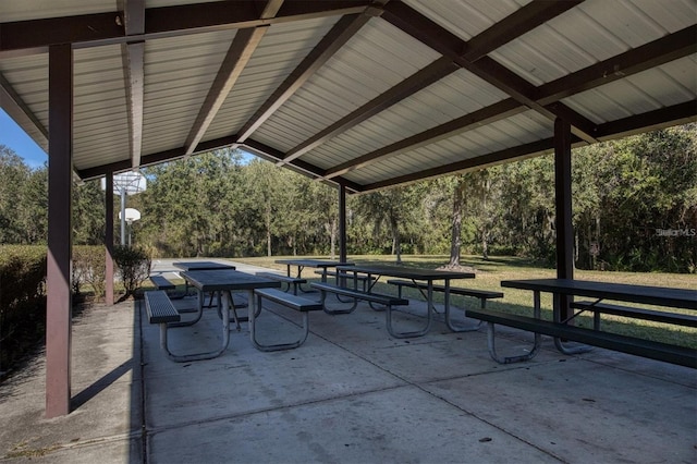 6907 47th Ct E, Ellenton, FL 34222 - view of patio / terrace featuring outdoor dining area and view of scattered trees