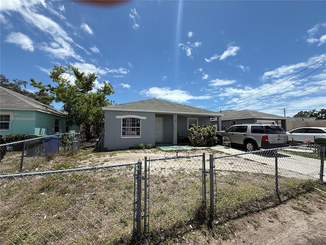 815 12th Ave W, Bradenton, FL 34205 - view of front of home with stucco siding and concrete driveway
