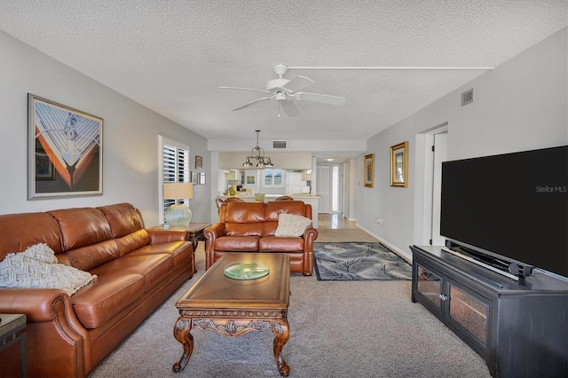 6480 Midnight Pass Rd Unit 311, Sarasota, FL 34242 - carpeted living area featuring a ceiling fan and a textured ceiling