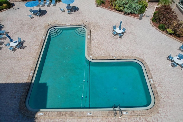 6480 Midnight Pass Rd Unit 311, Sarasota, FL 34242 - community pool featuring a patio