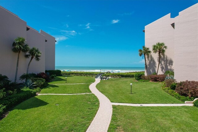6480 Midnight Pass Rd Unit 311, Sarasota, FL 34242 - view of grassy yard with a water view