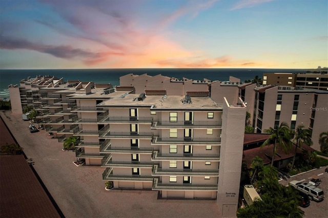 6480 Midnight Pass Rd Unit 311, Sarasota, FL 34242 - property at dusk featuring a water view