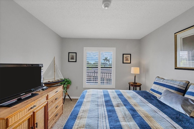 6480 Midnight Pass Rd Unit 311, Sarasota, FL 34242 - bedroom with carpet flooring and a textured ceiling
