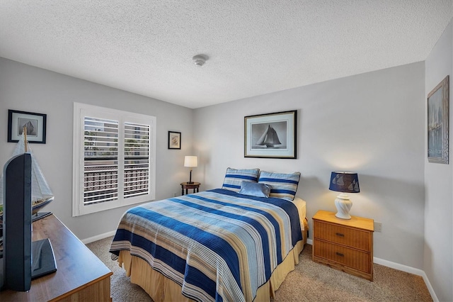 6480 Midnight Pass Rd Unit 311, Sarasota, FL 34242 - carpeted bedroom with baseboards and a textured ceiling
