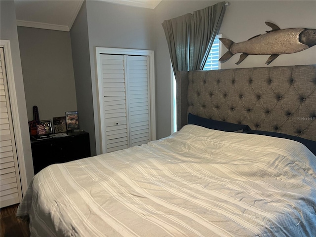 bedroom with ornamental molding, a closet, and dark wood-type flooring