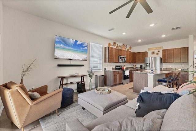 8628 Milestone Dr, Sarasota, FL 34238 - living room with a ceiling fan, light tile patterned flooring, and recessed lighting