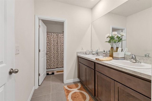8628 Milestone Dr, Sarasota, FL 34238 - bathroom featuring double vanity, baseboards, tile patterned flooring, and curtained shower