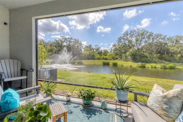 8628 Milestone Dr, Sarasota, FL 34238 - sunroom / solarium with a water view and view of scattered trees