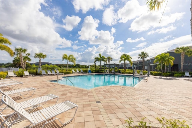 8628 Milestone Dr, Sarasota, FL 34238 - community pool with a patio area and fence