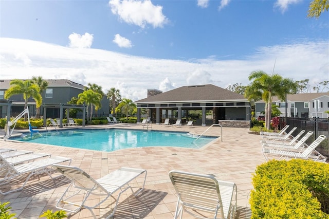 8628 Milestone Dr, Sarasota, FL 34238 - community pool with a patio, a pergola, and fence