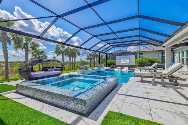 outdoor pool with an in-ground hot tub, a patio area, and a lanai