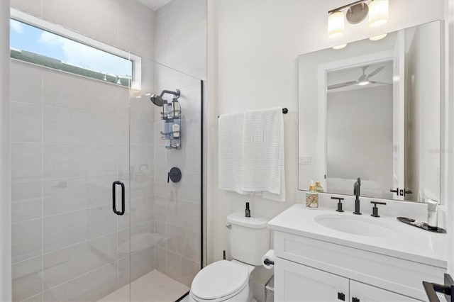bathroom featuring a stall shower, vanity, and toilet