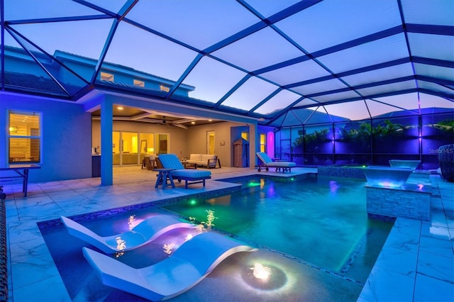 outdoor pool featuring a jacuzzi, a patio, a ceiling fan, an outdoor living space, and glass enclosure