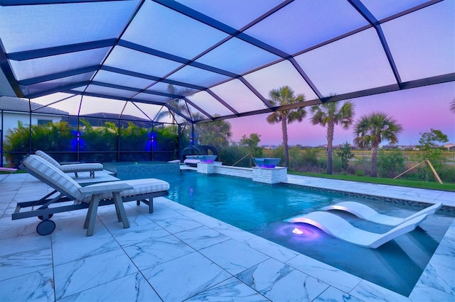 swimming pool featuring a patio area, glass enclosure, and a jacuzzi