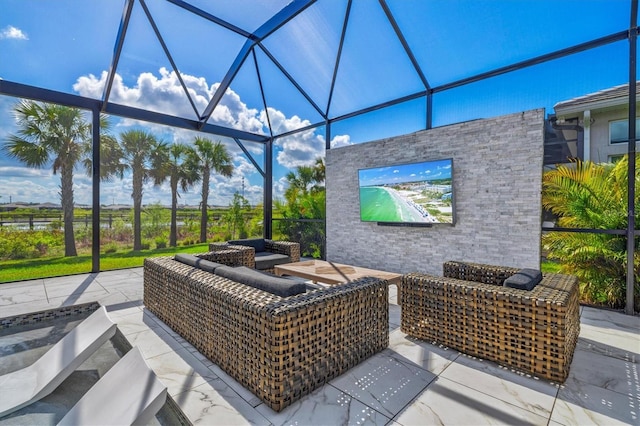view of patio / terrace with an outdoor living space and a lanai