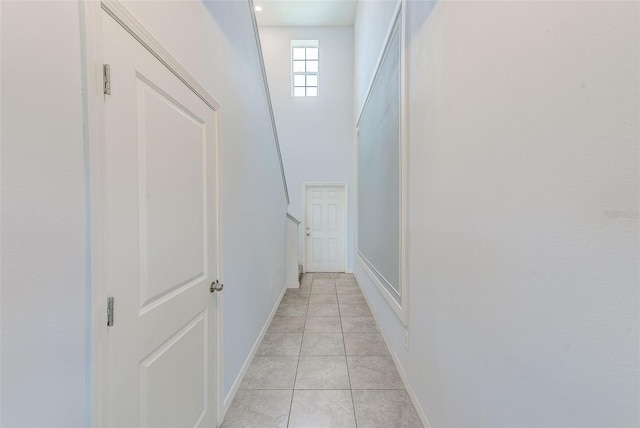 10944 Rainbow Pyrite Dr, Wimauma, FL 33598 - hall with light tile patterned floors and baseboards