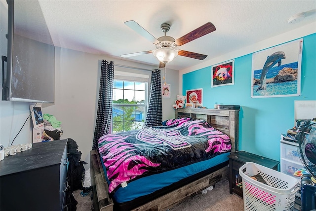 10944 Rainbow Pyrite Dr, Wimauma, FL 33598 - bedroom with a ceiling fan, carpet floors, and a textured ceiling