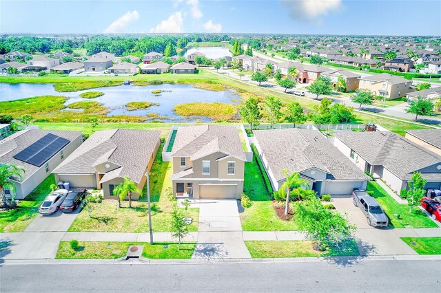 10944 Rainbow Pyrite Dr, Wimauma, FL 33598 - aerial perspective of suburban area featuring a large body of water