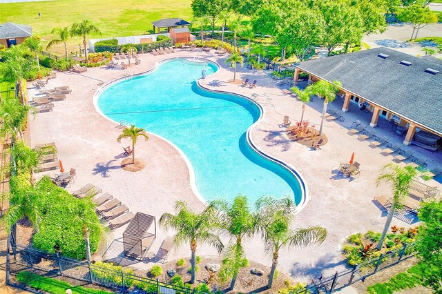 10944 Rainbow Pyrite Dr, Wimauma, FL 33598 - community pool featuring a patio area