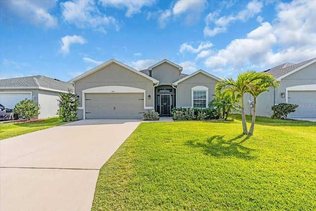 16411 62nd Gln E, Parrish, FL 34219 - ranch-style home featuring stucco siding, an attached garage, driveway, and a front lawn