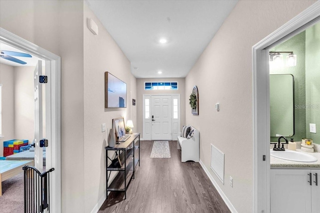 16411 62nd Gln E, Parrish, FL 34219 - entrance foyer featuring dark wood finished floors, baseboards, and ceiling fan