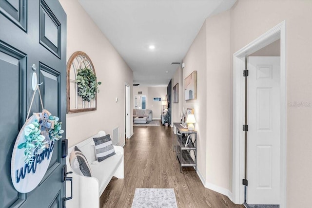 16411 62nd Gln E, Parrish, FL 34219 - hall with wood finished floors, baseboards, and recessed lighting
