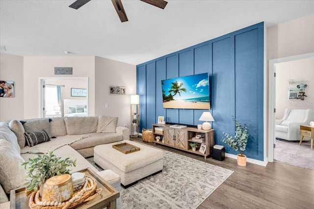 16411 62nd Gln E, Parrish, FL 34219 - living area with a ceiling fan, wood finished floors, baseboards, and a textured ceiling