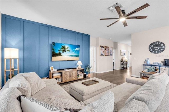 16411 62nd Gln E, Parrish, FL 34219 - living area featuring wood finished floors, a ceiling fan, and baseboards