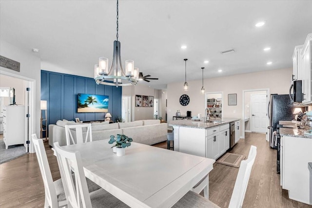 16411 62nd Gln E, Parrish, FL 34219 - dining room with a chandelier, light wood-style flooring, recessed lighting, and a ceiling fan