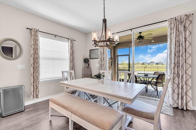 16411 62nd Gln E, Parrish, FL 34219 - dining room featuring wood finished floors, healthy amount of natural light, and baseboards