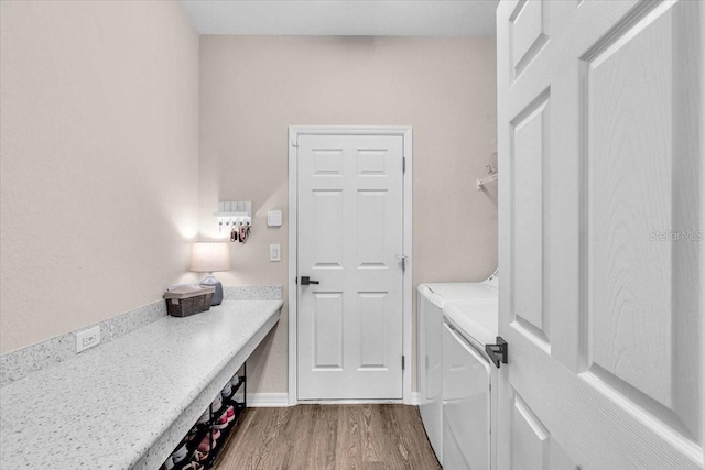 16411 62nd Gln E, Parrish, FL 34219 - washroom featuring washer and dryer and wood finished floors