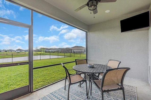 16411 62nd Gln E, Parrish, FL 34219 - sunroom with a ceiling fan, a residential view, outdoor dining space, and healthy amount of natural light