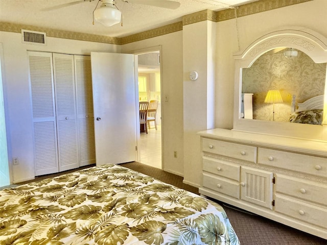 6124 43rd St W Unit 104A, Bradenton, FL 34210 - bedroom featuring a closet, ceiling fan, and dark carpet