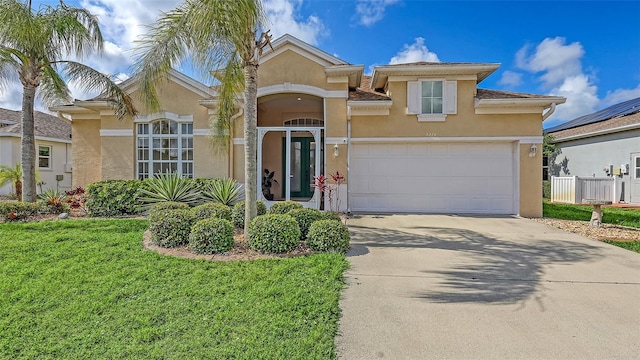 4274 Tennyson Way, Venice, FL 34293 - mediterranean / spanish home with stucco siding and concrete driveway