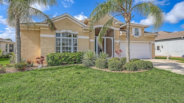 4274 Tennyson Way, Venice, FL 34293 - view of front of house with stucco siding, driveway, a front lawn, and a garage