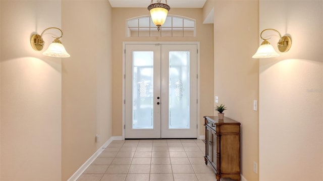 4274 Tennyson Way, Venice, FL 34293 - foyer featuring french doors, light tile patterned floors, and baseboards