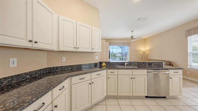 4274 Tennyson Way, Venice, FL 34293 - kitchen with stainless steel dishwasher, a sink, ceiling fan, light tile patterned flooring, and a peninsula