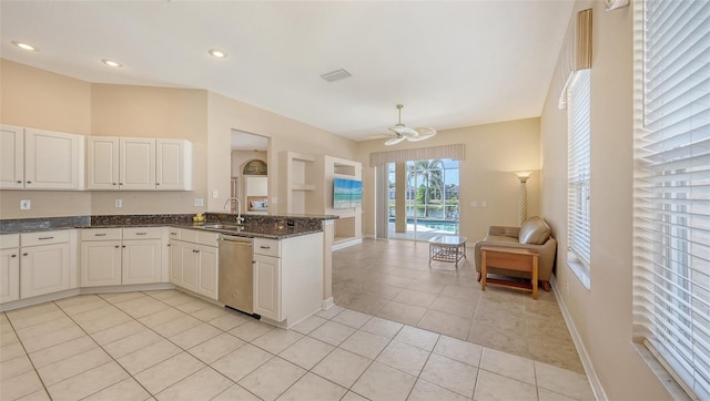 4274 Tennyson Way, Venice, FL 34293 - kitchen with stainless steel dishwasher, a ceiling fan, open floor plan, light tile patterned floors, and a peninsula