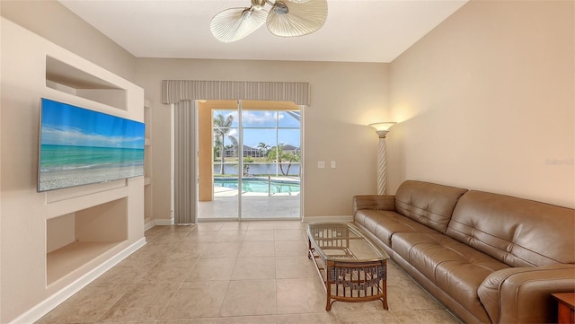 4274 Tennyson Way, Venice, FL 34293 - living room with baseboards, ceiling fan, and light tile patterned floors