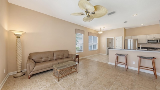 4274 Tennyson Way, Venice, FL 34293 - living room featuring ceiling fan, baseboards, recessed lighting, and light tile patterned flooring