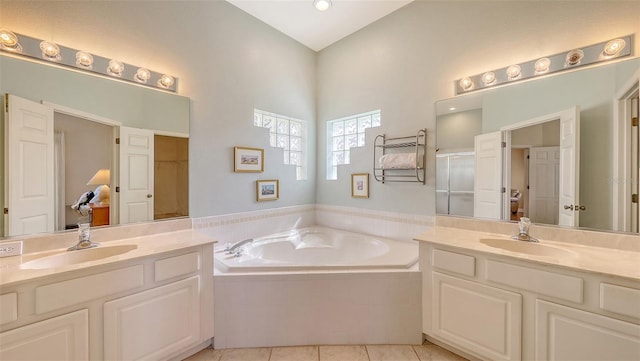 4274 Tennyson Way, Venice, FL 34293 - bathroom featuring a garden tub, two vanities, and tile patterned flooring