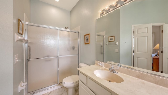 4274 Tennyson Way, Venice, FL 34293 - bathroom with toilet, vanity, a shower stall, and tile patterned flooring