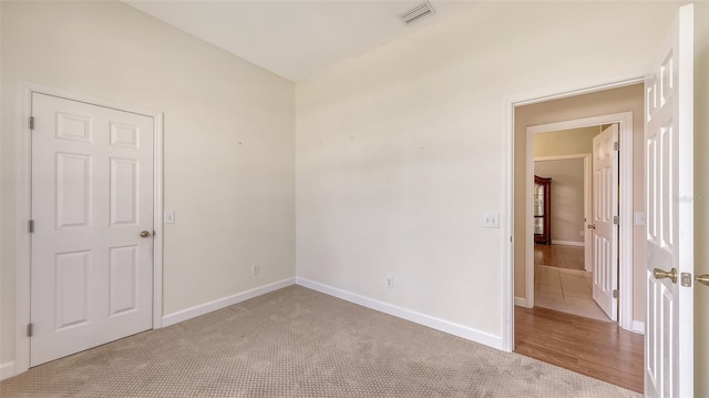 4274 Tennyson Way, Venice, FL 34293 - carpeted empty room with baseboards and vaulted ceiling