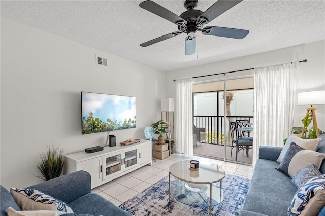 5681 Midnight Pass Rd Unit 104, Sarasota, FL 34242 - living room featuring light tile patterned floors, a textured ceiling, and ceiling fan