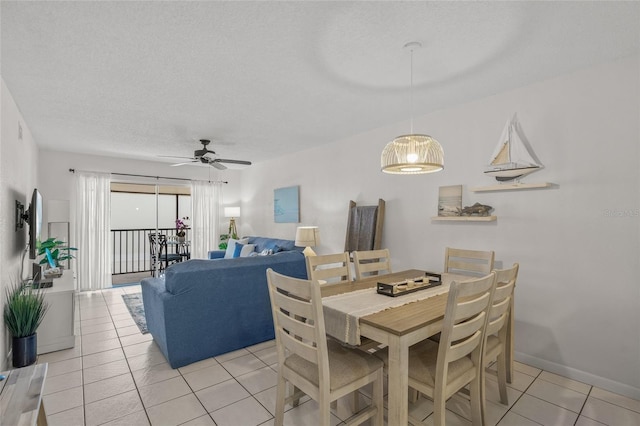 5681 Midnight Pass Rd Unit 104, Sarasota, FL 34242 - dining room with light tile patterned flooring, ceiling fan, and baseboards