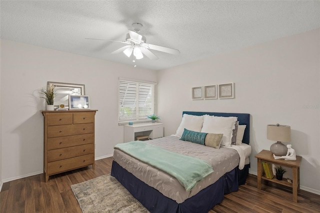 5681 Midnight Pass Rd Unit 104, Sarasota, FL 34242 - bedroom with wood finished floors, a textured ceiling, baseboards, and a ceiling fan
