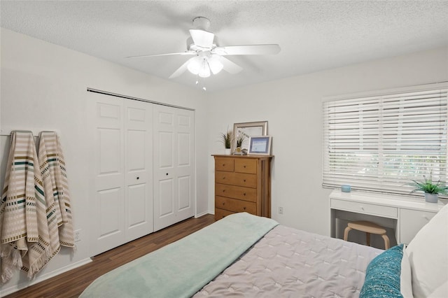 5681 Midnight Pass Rd Unit 104, Sarasota, FL 34242 - bedroom with wood finished floors, a closet, a textured ceiling, and a ceiling fan