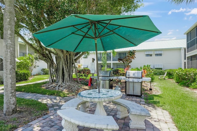 5681 Midnight Pass Rd Unit 104, Sarasota, FL 34242 - view of patio featuring grilling area