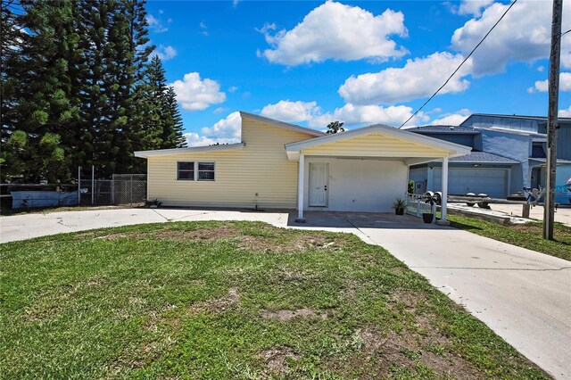 7308 Maryland Ave, Hudson, FL 34667 - view of front of property with driveway and a carport